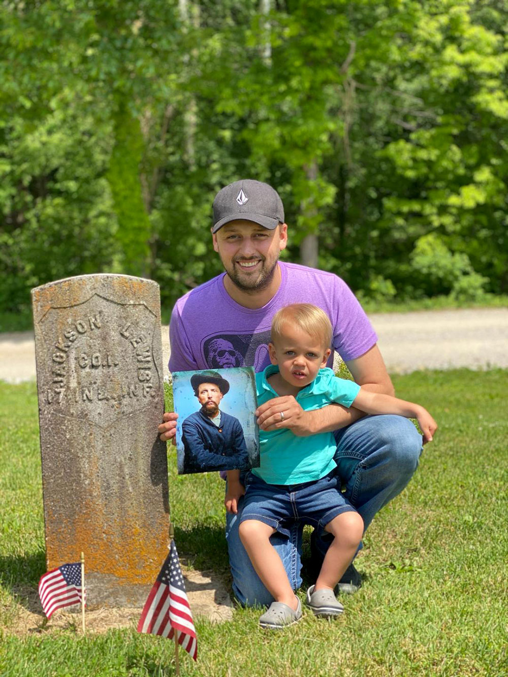 Jed Brian, with his son in tow, visits the grave of Andrew Jackson Lewis (1836-1884) in Little Zion Cemetery in Pike County, Ind. Lewis, who served in the ranks of Company I, 17th Indiana Infantry, is Jed’s great-grandfather. Jed holds a colorized restoration of an original tintype.